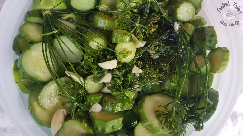 Refrigerator pickles in an ice cream pail.