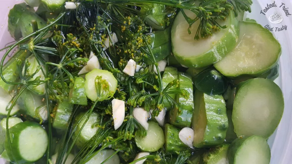 Refrigerator pickles in an ice cream pail.