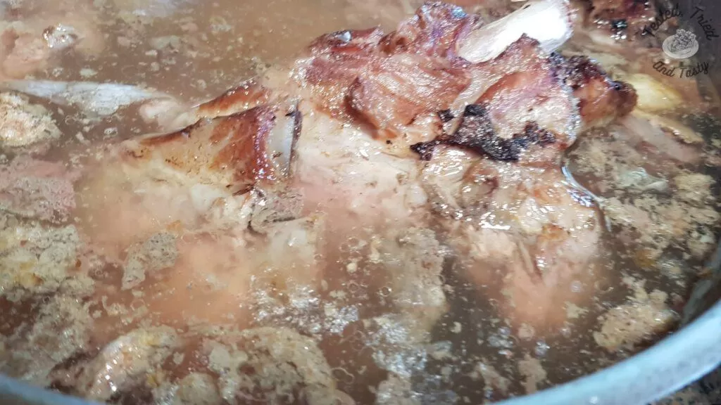 Spare ribs in a large saucepan to make soup stock for beet borscht.