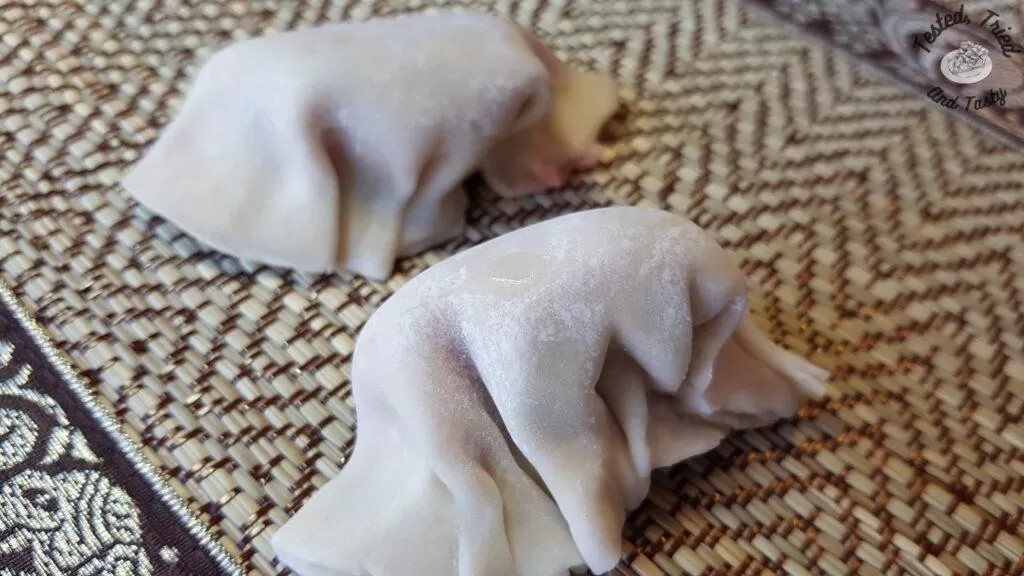 Folded wontons ready to be cooked.
