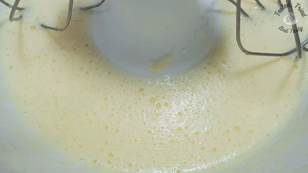 Eggs beat in a large mixer.