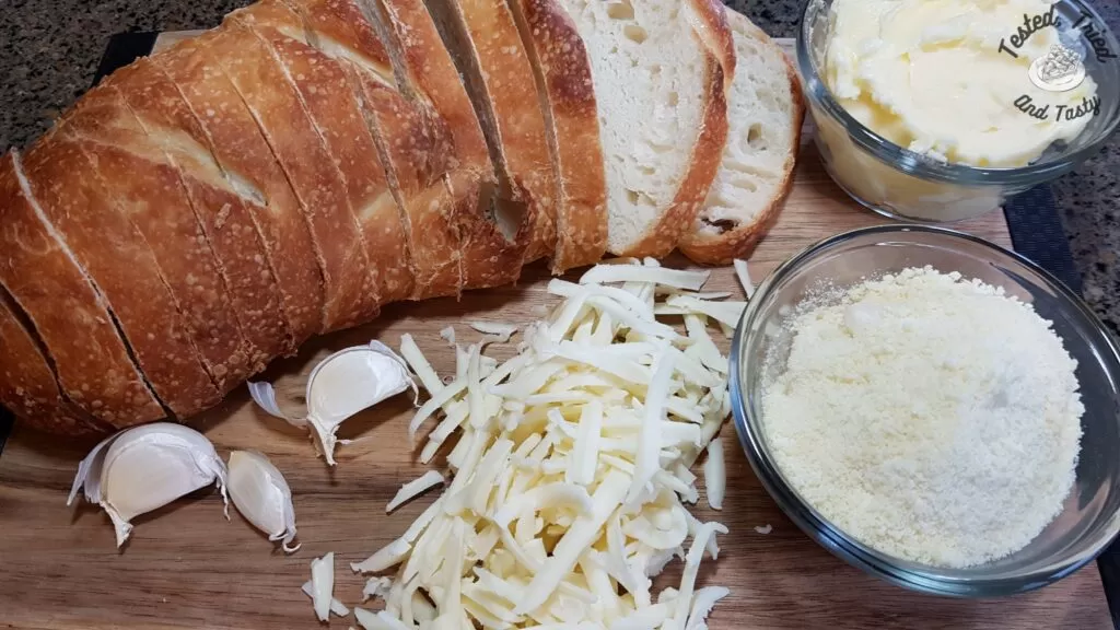 Ingredients for garlic cheese bread with sourdough french bread.