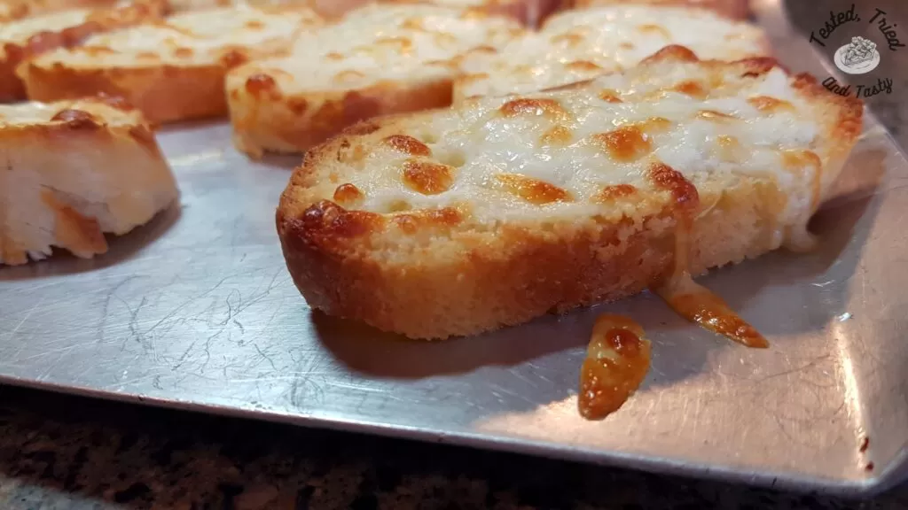 Garlic cheese bread on an airbake baking sheet.