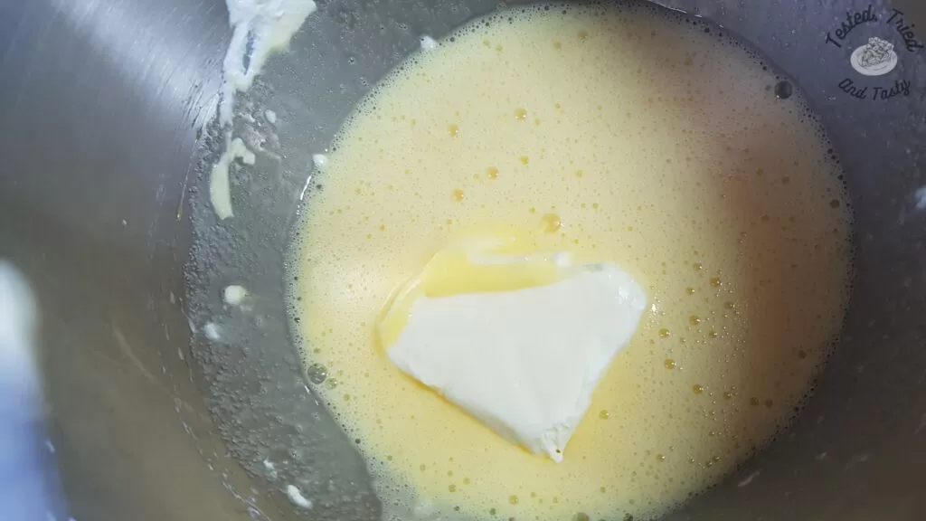 Butter added to the egg/sugar mixture.