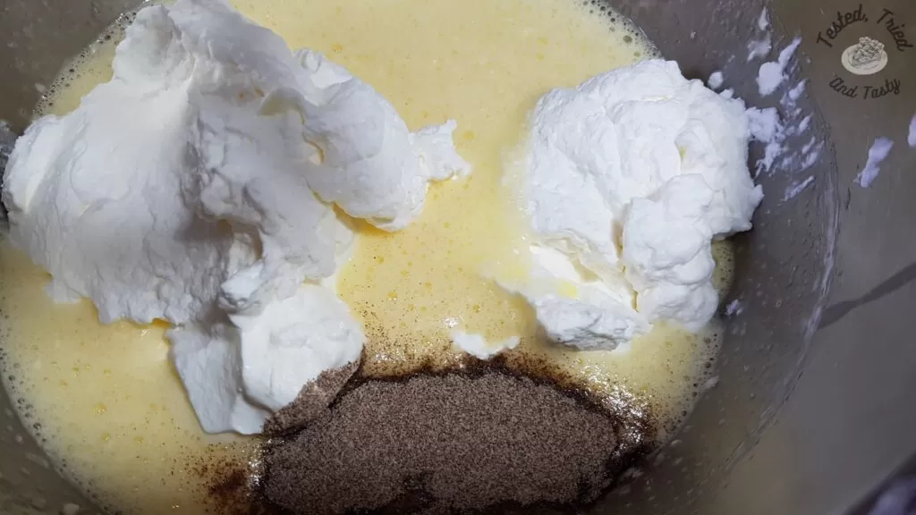 Whipped cream and cardamom added to the egg and sugar mixture.