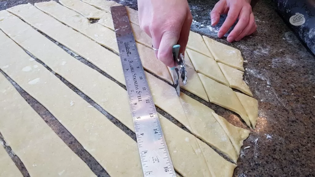 Cutting the strips into diamond shapes.