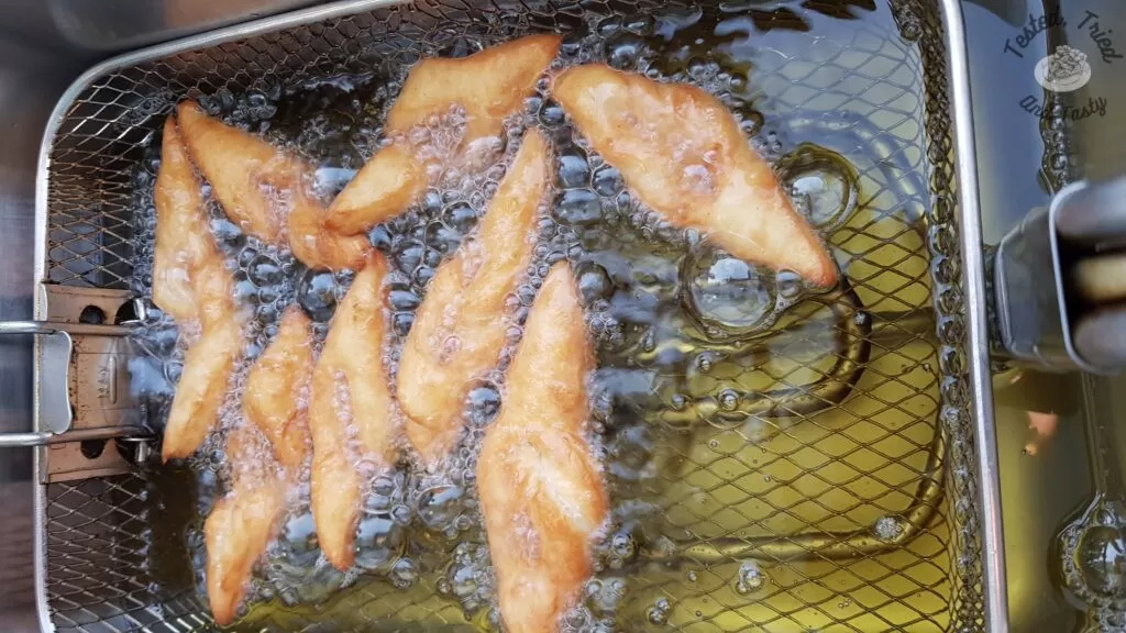 Fattigman in the deep fryer.