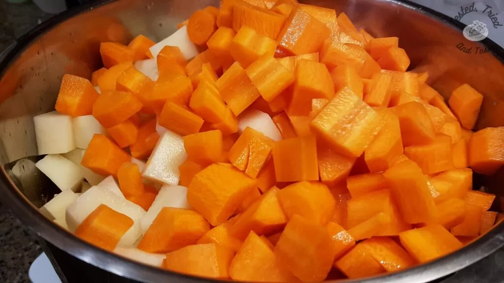 Carrots and potatoes in a large saucepan.