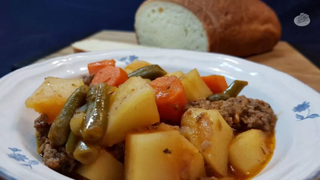 Easy stovetop hamburger stew with homemade sourdough bread.