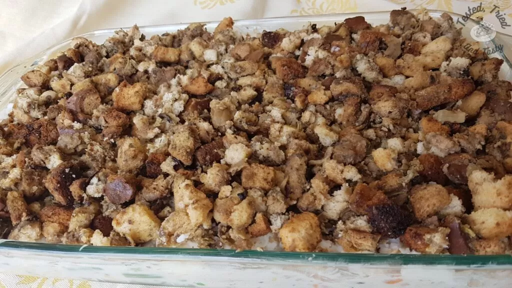 Mashed potatoes and stuffing on top of the meat and gravy mixture for leftover turkey casserole.